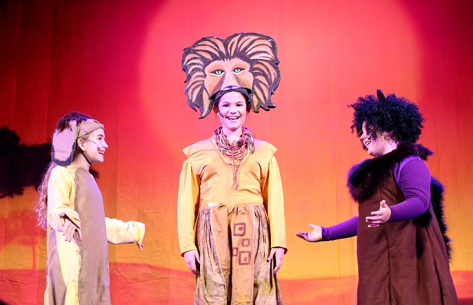 Cast members performing The Lion King Kids