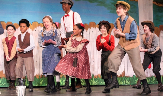 Actors in costumes from The Adventures of Tom Sawyer