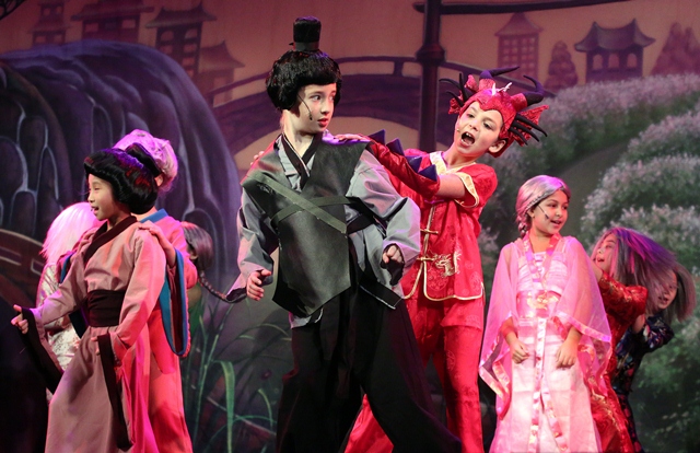 Actors in costumes from Mulan Jr