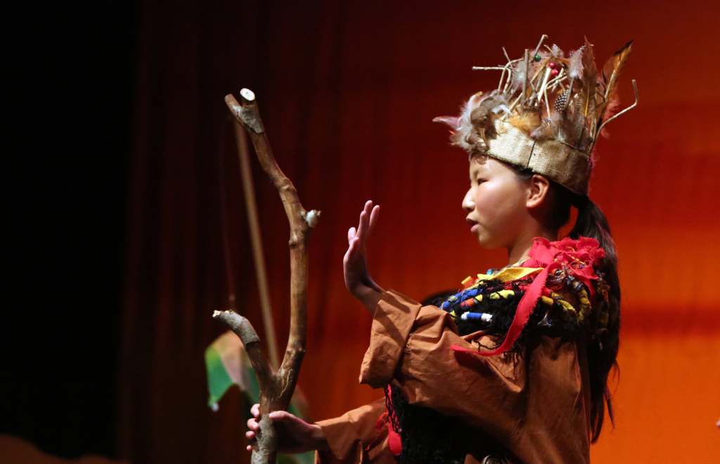 An actor performing in The Lion King Kids