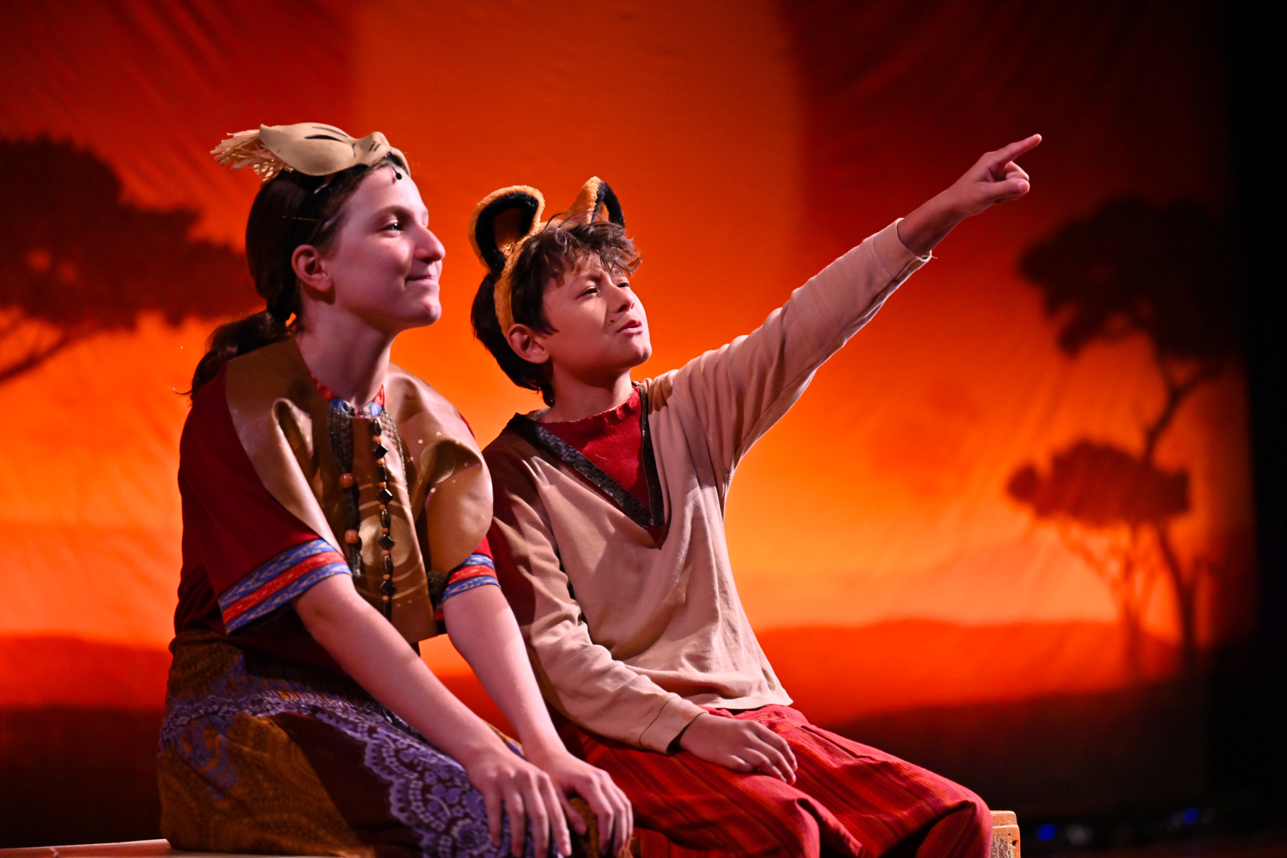 Actors performing The Lion King Jr.