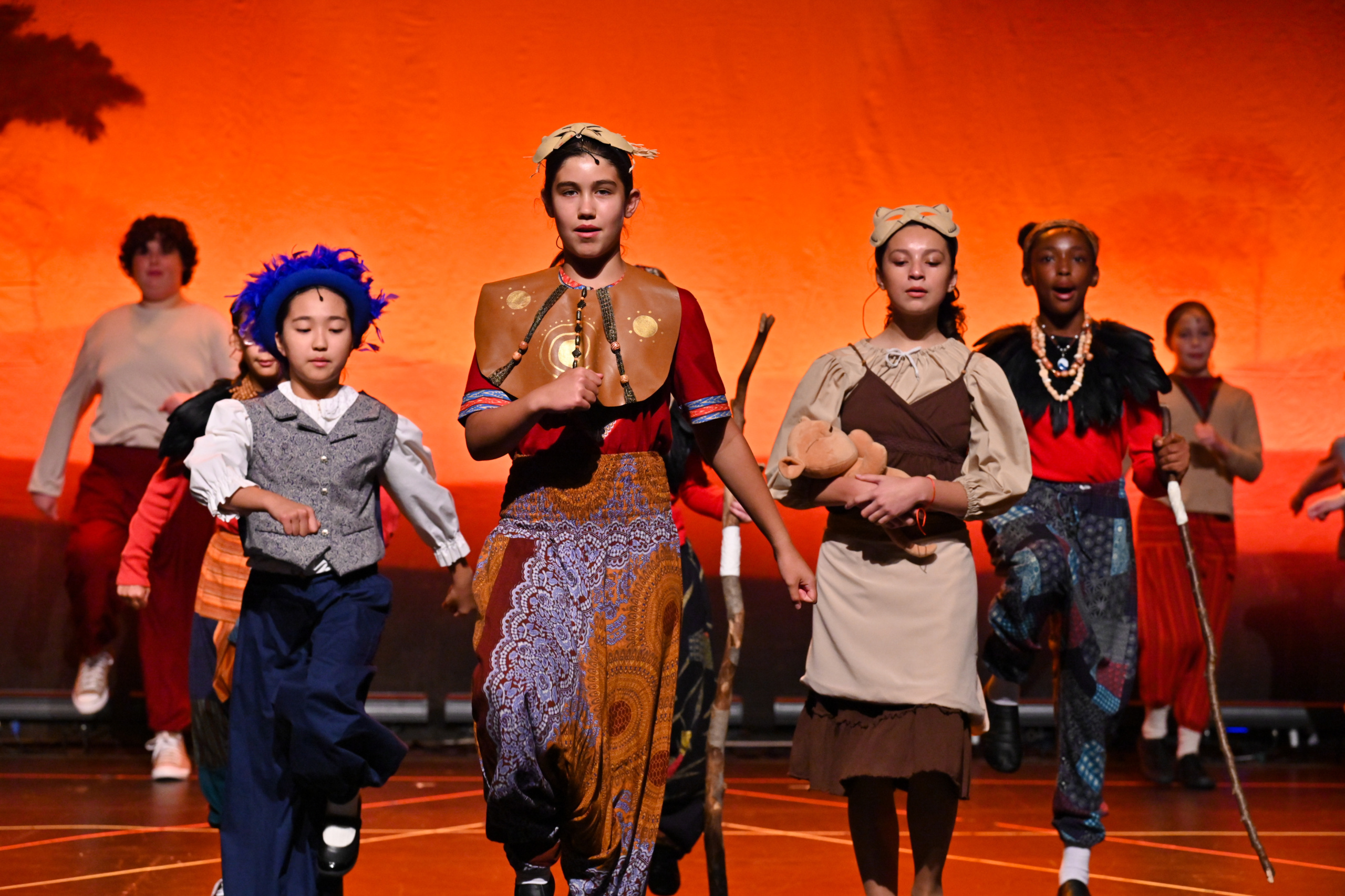Cast members performing The Lion King Kids